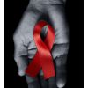 Red ribbon on hands for HIV awareness