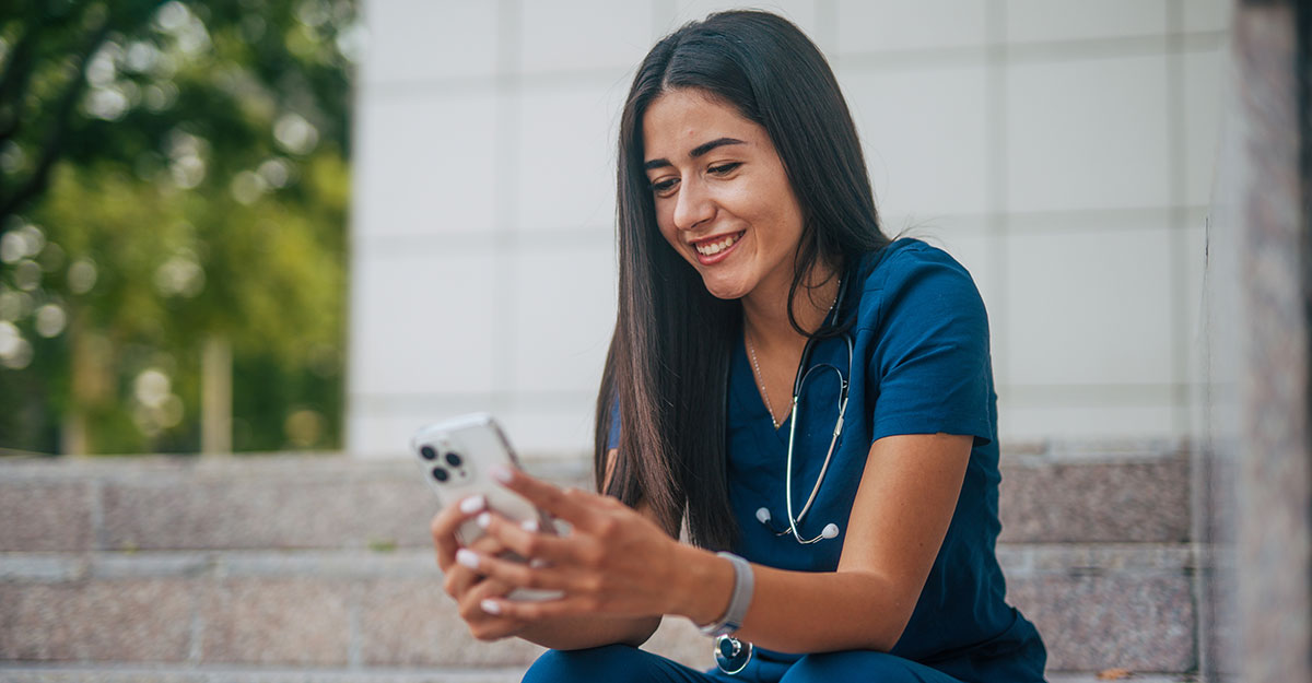 Nurse engaged on her phone